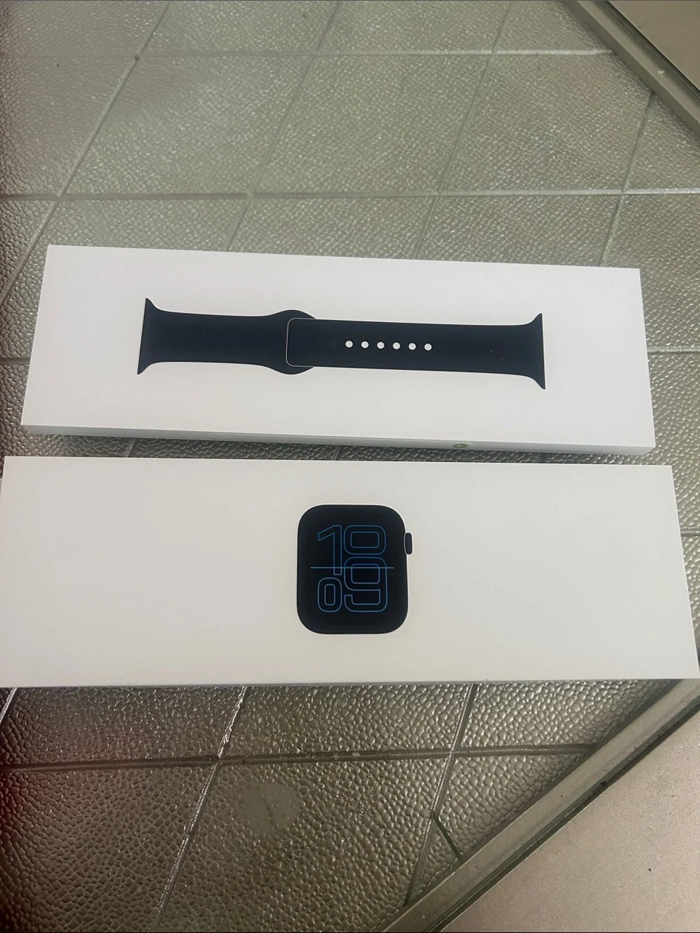 Apple Watch with Black Sport Band in White Packaging